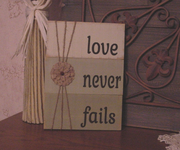 Love Never Fails Distressed Wooden Sign - 113