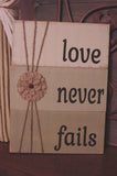 Love Never Fails Distressed Wooden Sign - 113